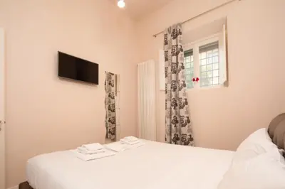 Letto o letti in una camera di Florence Cozy Duplex