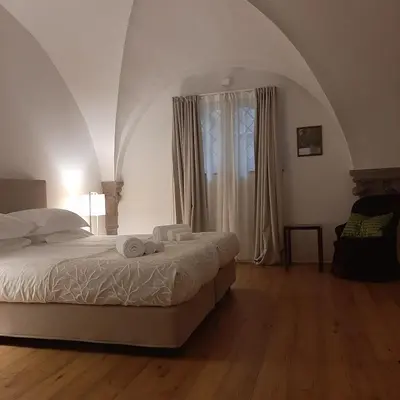 Letto o letti in una camera di Palazzo Capponi alle Rovinate