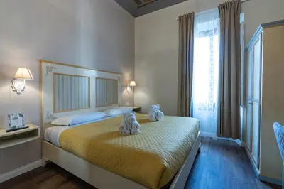 Letto o letti in una camera di Sweet Home XX Settembre