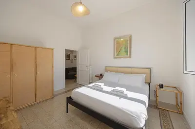 Letto o letti in una camera di Magide Fortezza Apartment Lavagnini