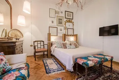 Letto o letti in una camera di Art Suite Statuto