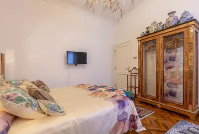 Letto o letti in una camera di Art Suite Statuto