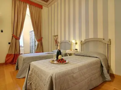 Letto o letti in una camera di Maggio Suite