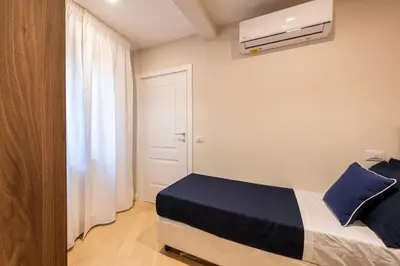Letto o letti in una camera di Blue Santa Croce by MMega