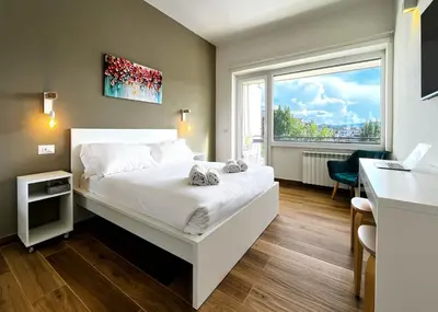 Letto o letti in una camera di Alma Suites - Terraced Penthouses