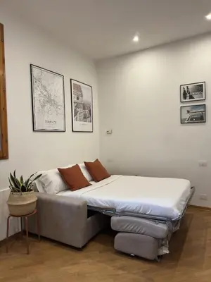 Letto o letti in una camera di Niccolò Apartment-Florence Historic Center