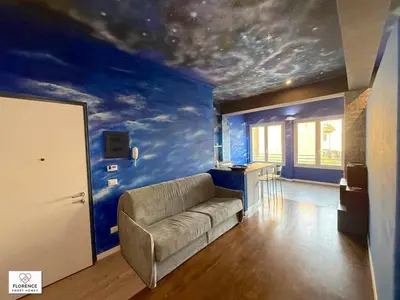 Area soggiorno di Blue Sky Apartment by Florence Sweet Homes