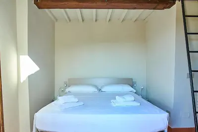 Letto o letti in una camera di Appartamento di charme con terrazza