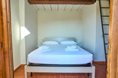 Letto o letti in una camera di Appartamento di charme con terrazza