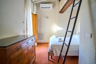 Letto o letti in una camera di Appartamento di charme con terrazza