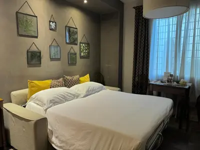 Letto o letti in una camera di La Corte Home Tower QK Costa 58