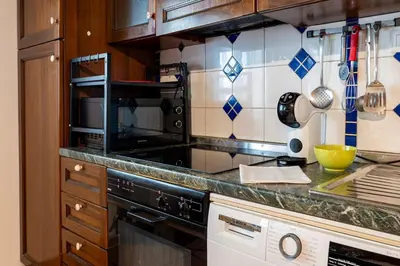 Cucina o angolo cottura di Very Central Apartment 5 mins from Train Station and Duomo