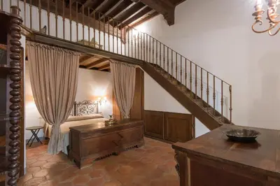 Letto o letti in una camera di San Niccolò Loft Suite