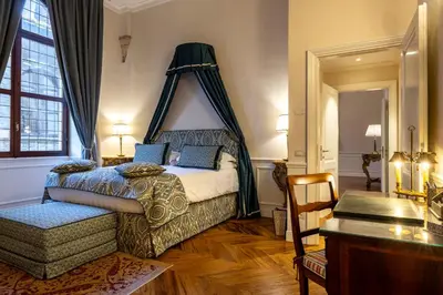 Letto o letti in una camera di The Loggia of Borgo SS Apostoli
