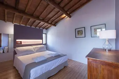 Letto o letti in una camera di Attic Up On Florence