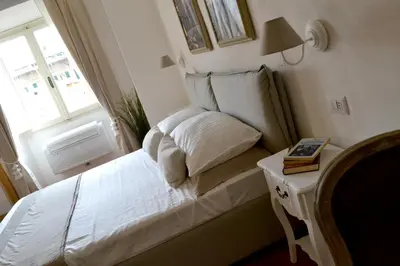 Letto o letti in una camera di LE QUATTRO MURA EXCLUSIVE