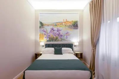 Letto o letti in una camera di Hotel Settefiori