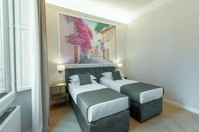 Letto o letti in una camera di Hotel Settefiori
