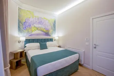 Letto o letti in una camera di Hotel Settefiori