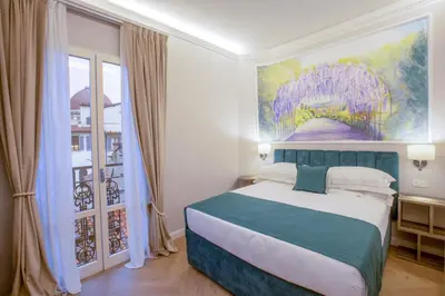 Letto o letti in una camera di Hotel Settefiori