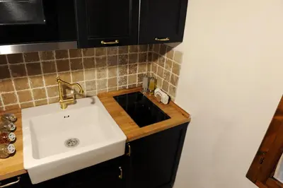 Cucina o angolo cottura di ARIA DI CASA APARTMENT