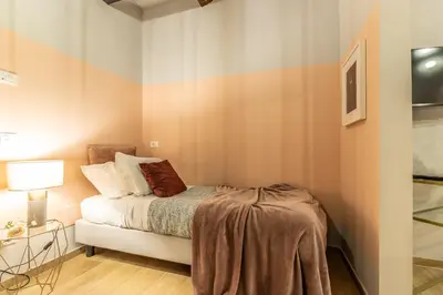 Letto o letti in una camera di Wine Apartments Florence Biancone