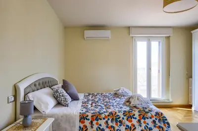 Letto o letti in una camera di Alessandria's House