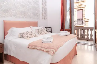 Letto o letti in una camera di La Perla Fiorentina