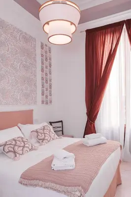Letto o letti in una camera di La Perla Fiorentina