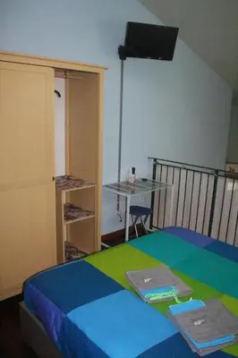 Letto o letti in una camera di La Piccola Maison Firenze intera casa indipendente Careggi Rifredi