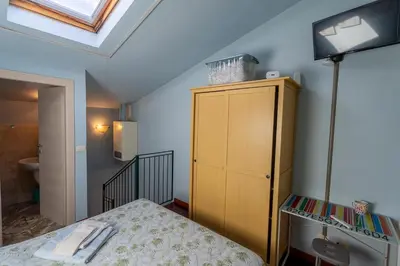 Letto o letti in una camera di La Piccola Maison Firenze intera casa indipendente Careggi Rifredi