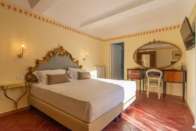 Letto o letti in una camera di Palazzo Guelfa Apt