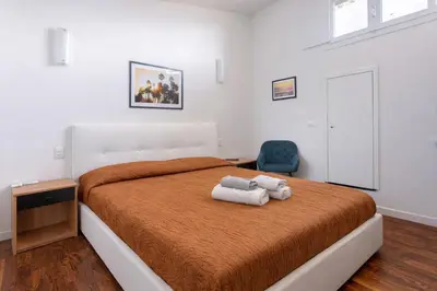 Letto o letti in una camera di I profumi del centro