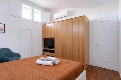 Letto o letti in una camera di I profumi del centro
