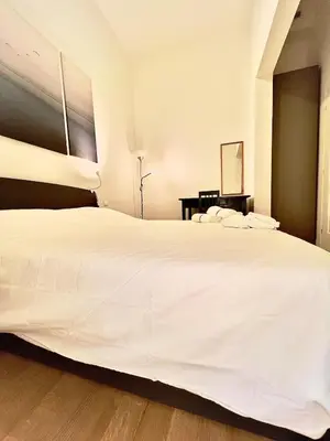 Letto o letti in una camera di appartamento centro firenze AIRC WiFi and Netflix