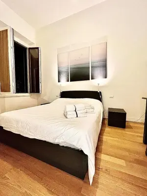 Letto o letti in una camera di appartamento centro firenze AIRC WiFi and Netflix