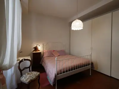Letto o letti in una camera di Alloggiare nei luoghi dove é vissuto Dante