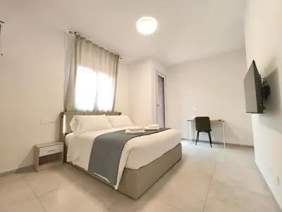 Letto o letti in una camera di Baracca Space Apartments