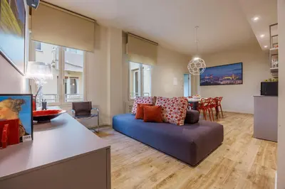 Area soggiorno di Liberty Lucia Apartment Florence
