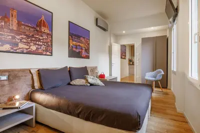 Letto o letti in una camera di Liberty Lucia Apartment Florence