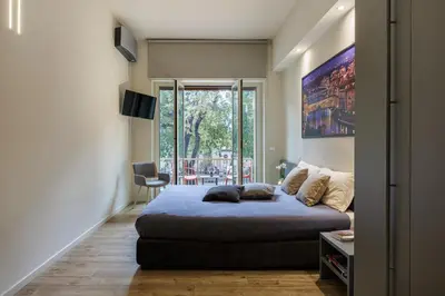 Letto o letti in una camera di Liberty Betta Apartment Florence