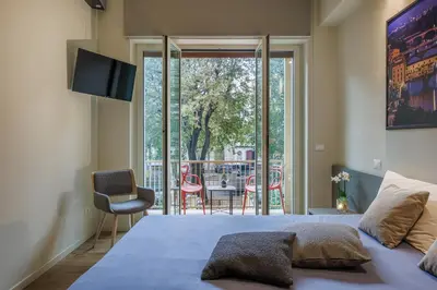 Letto o letti in una camera di Liberty Betta Apartment Florence