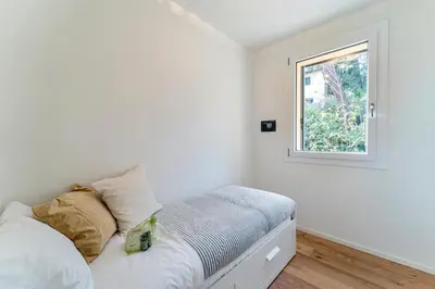 Letto o letti in una camera di UNYCA - Florence Oltrarno Apartment