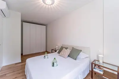 Letto o letti in una camera di UNYCA - Florence Oltrarno Apartment