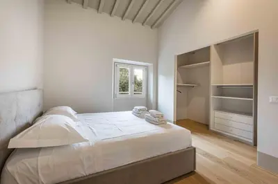 Letto o letti in una camera di La casa agli Orti Oricellari by MMega