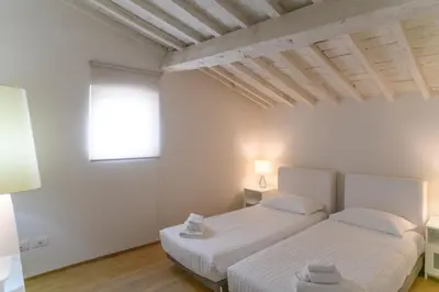 Letto o letti in una camera di Dimora Adimari