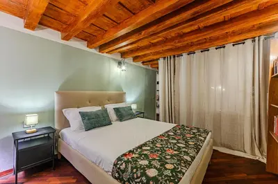 Letto o letti in una camera di Soggiorno autentico vicino a Santa Croce