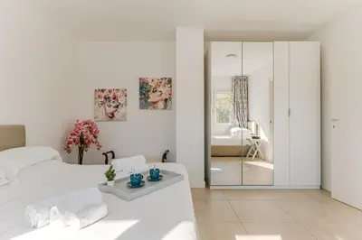 Letto o letti in una camera di Casa Gardenia - Centro e Stazione
