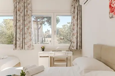 Letto o letti in una camera di Casa Gardenia - Centro e Stazione