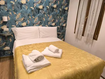 Letto o letti in una camera di Camera in centro a pochi passi dalla stazione